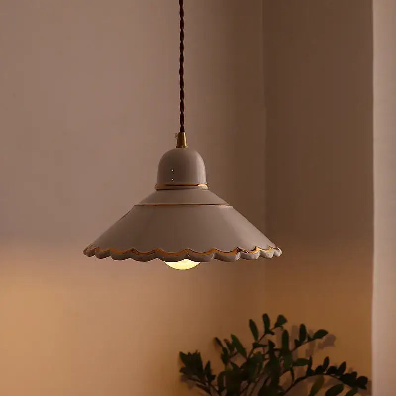 Soft off-white ceramic decorbites led pendant lamp with scalloped edge gold trim and twisted brown cord for home lighting