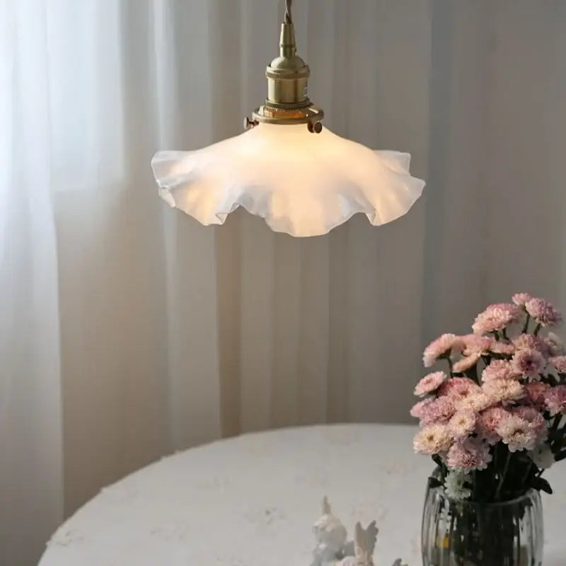 Decorbites led pendant lamp with off-white ruffled glass shade and brass fixture featuring adjustable knob switch