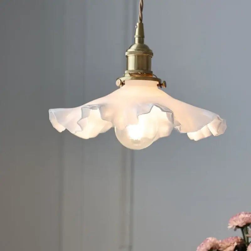 Decorbites led pendant lamp featuring an off-white ruffled glass shade with brass-finished adjustable knob switch