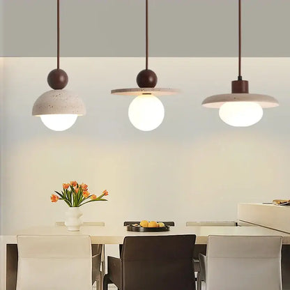 Three matte brown decorbites led pendant lamps with concrete shades and white globe bulbs for kitchen bedroom lighting