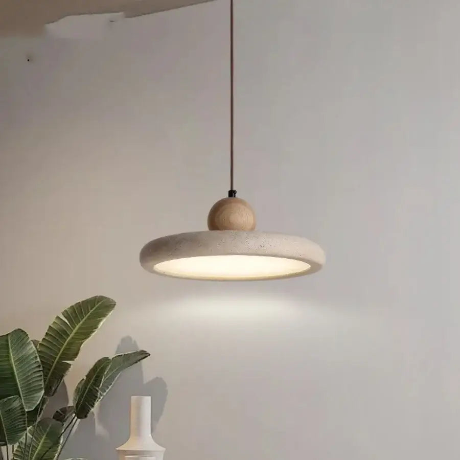 Minimalist decorbites led pendant with matte concrete disc and natural wood sphere suspended by thin black cord