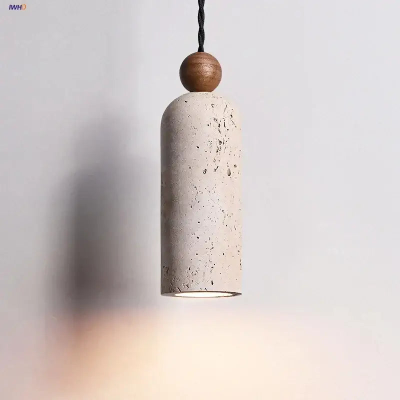 Decorbites led pendant lamp with a textured off-white concrete body, yellow travertine wood sphere, and black braided cord