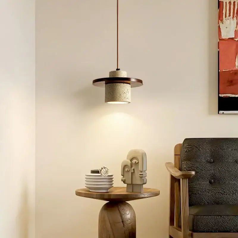 Modern concrete decorbites led pendant lamp with dark wood accent ring and textured cylindrical shade in yellow travertine