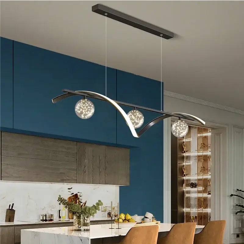Modern minimalist decorbites led pendant lamp with curved metallic frame and three glass globes for dining room lighting