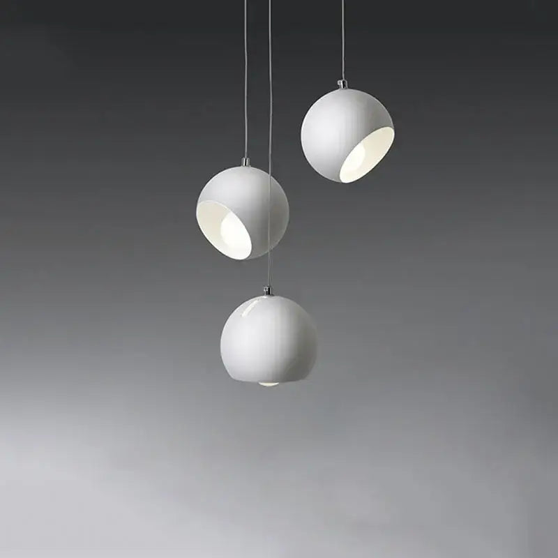 Three white spherical matte pendant lights with subtle metallic accents in the DecorBites LED pendant lamp 2023 collection