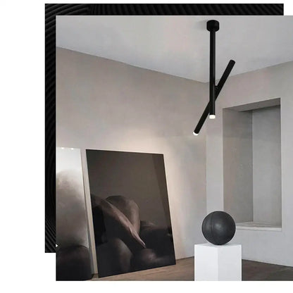 Black minimalist DecorBites LED pendant light with two intersecting aluminum arms for living room and kitchen use