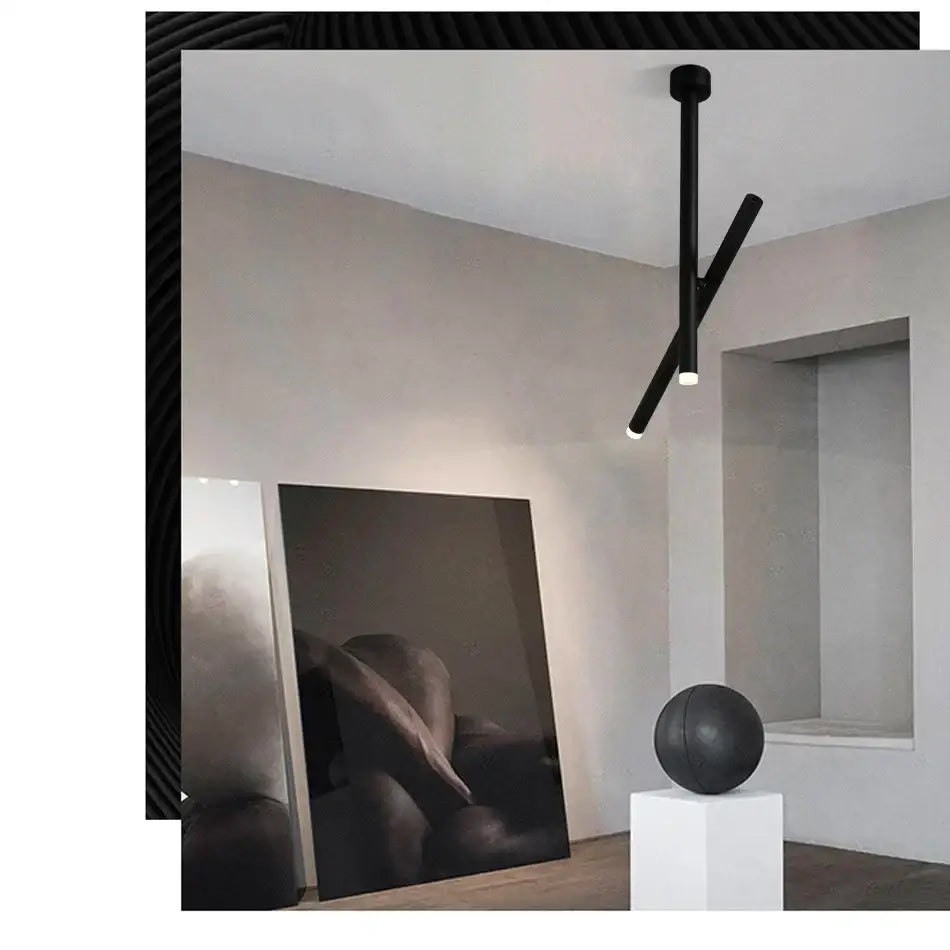 Black minimalist DecorBites LED pendant light with two intersecting aluminum arms for living room and kitchen use