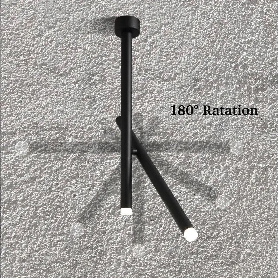 Black matte-finished DecorBites led pendant light with two angled arms and illuminated ends for living room use
