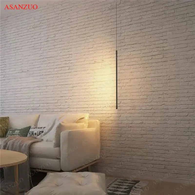 Minimalist black DecorBites™ LED pendant light with sleek cylindrical design and adjustable line strip for modern decor