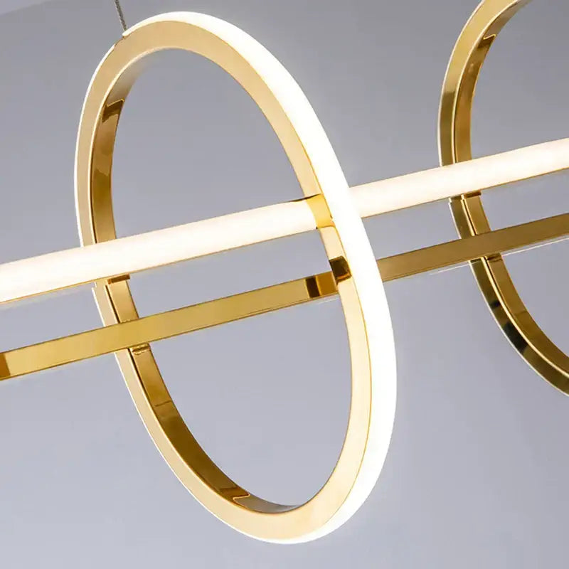 Modern gold-toned DecorBites led pendant light with sleek circular rings and glowing white LED strip for home decor