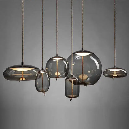 Set of decorbites led pendant light chandelier with smoked glass, brass accents, and braided cords for modern spaces