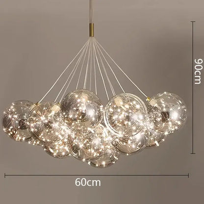 A modern DecorBites led pendant chandelier with transparent glass spheres and internal LED lights for living and dining rooms