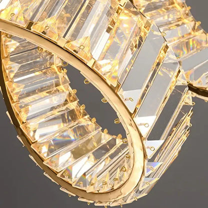 Gold-toned decorbites led pendant light chandelier with faceted crystal prisms in circular design for living room decor