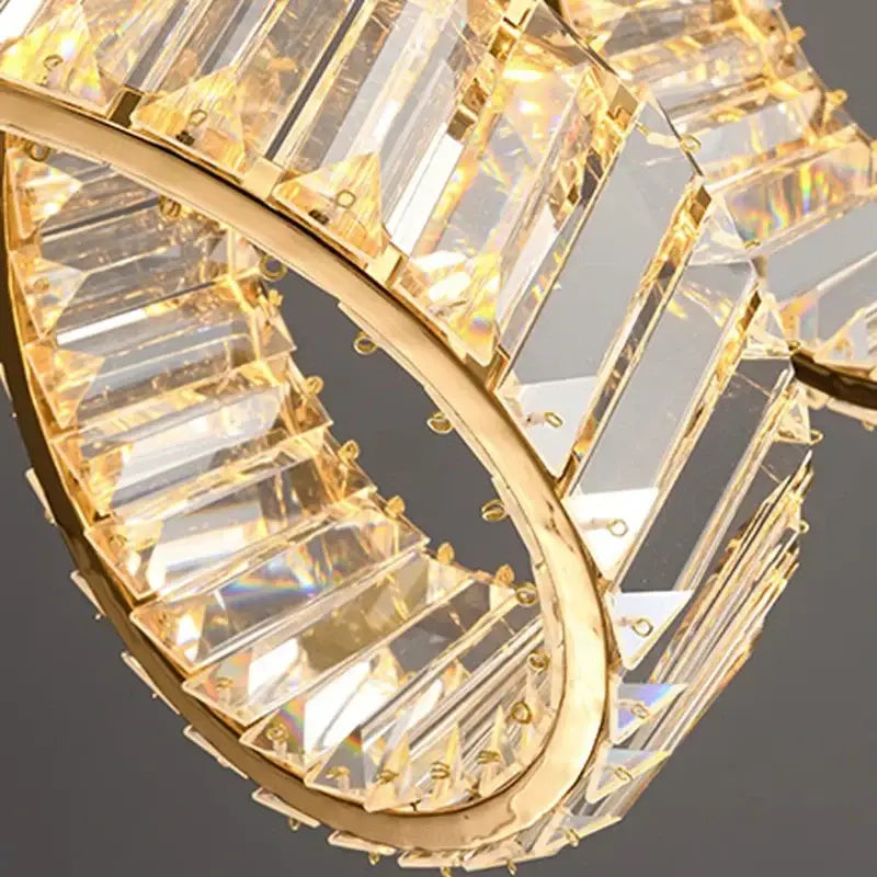 Gold-toned decorbites led pendant light chandelier with faceted crystal prisms in circular design for living room decor