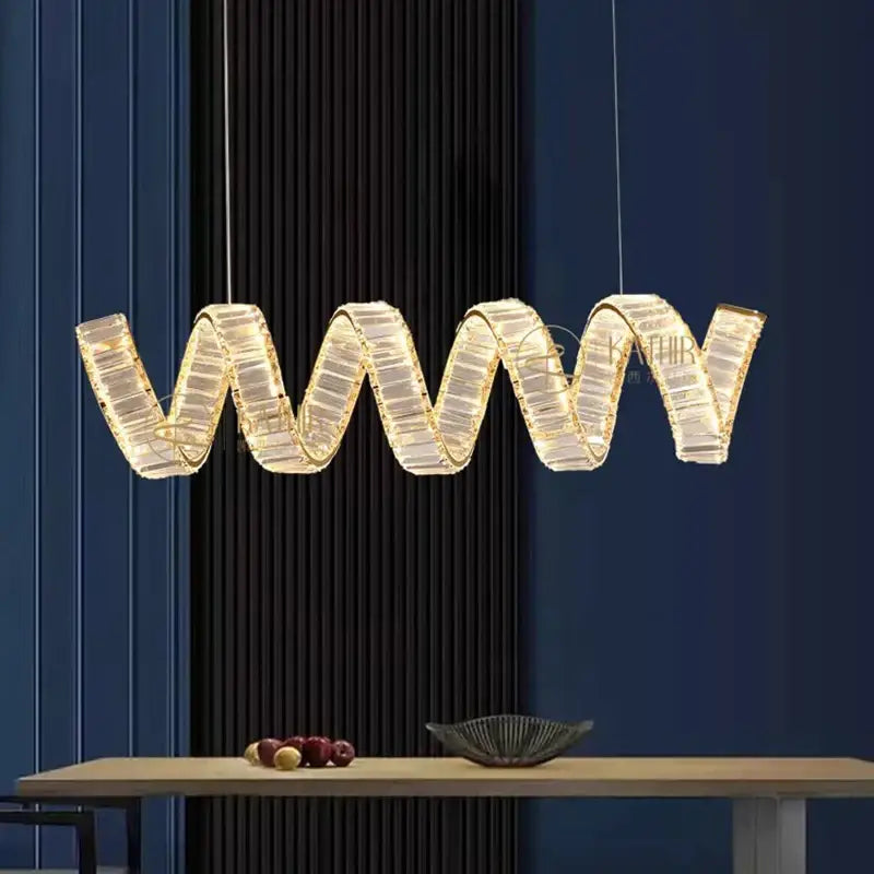 A modern gold-accented crystal pendant light with wavy design by decorbites led pendant for living room decor