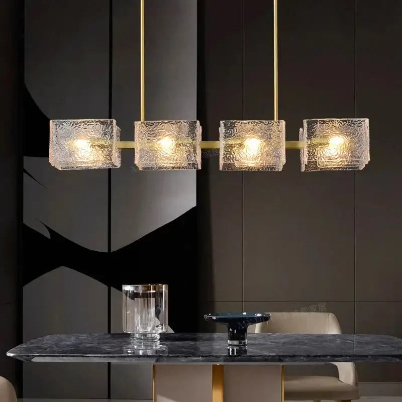 Decorbites led pendant light chandeliers featuring modern gold-toned metal with four textured translucent glass cubes
