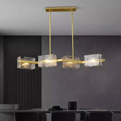 Gold-toned decorbites led pendant light chandelier with textured translucent glass cubes for indoor living and dining rooms