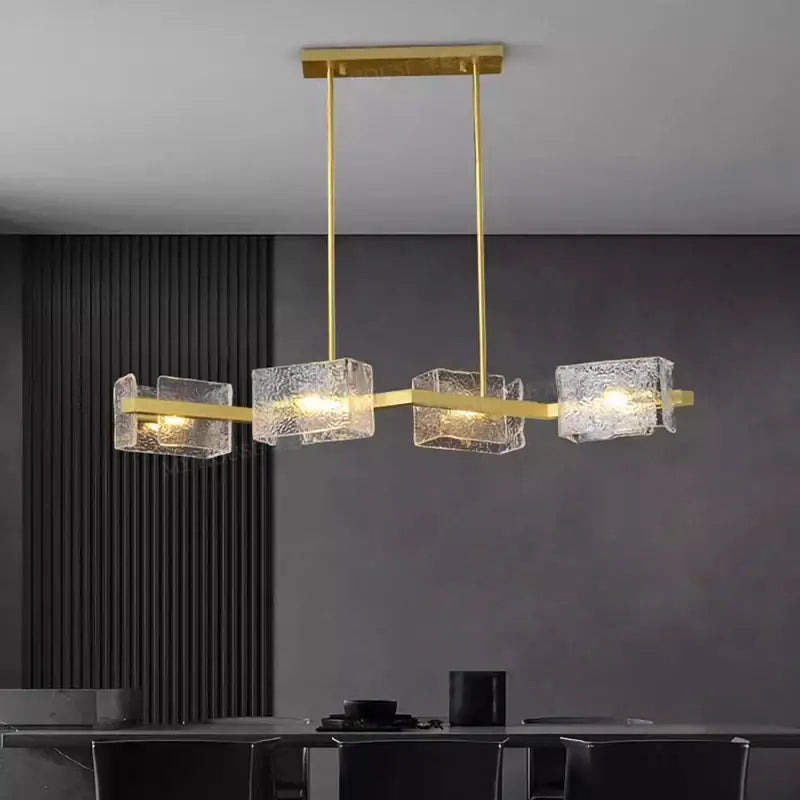 Gold-toned decorbites led pendant light chandelier with textured translucent glass cubes for indoor living and dining rooms