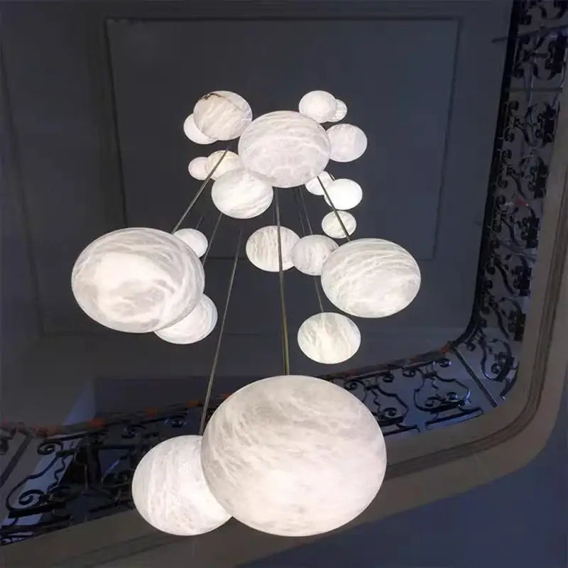 A modern DecorBites LED pendant light chandelier with marble finish spherical lights for living room indoor lighting