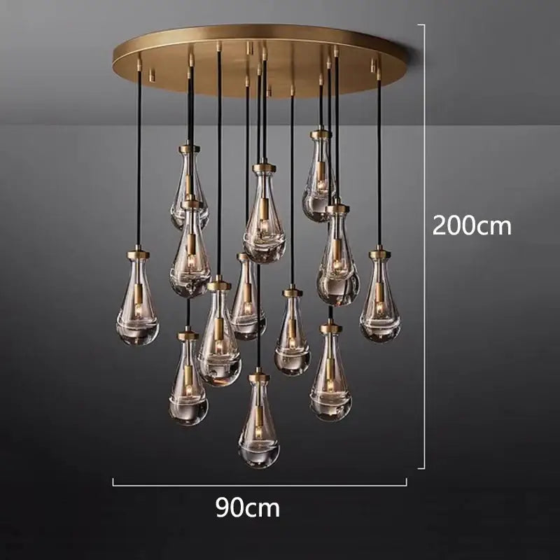 A modern brass decorbites led pendant light chandelier with teardrop glass pendant lights for living room lighting