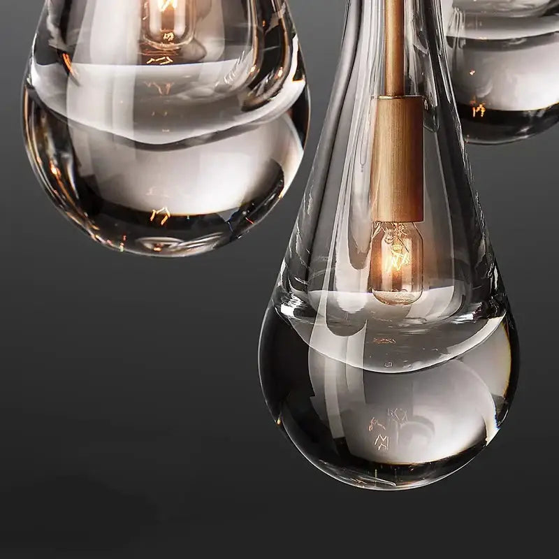 Clear glass teardrop pendant lights with brass accents and exposed filament bulbs by decorbites led pendant light chandeliers