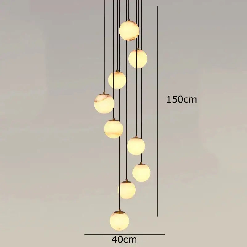 A modern DecorBites™ LED pendant light chandelier with spherical glass bulbs and black cords for indoor lighting