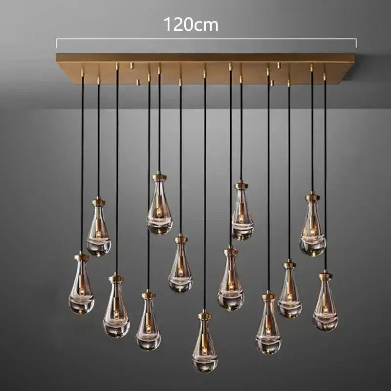 A modern 120cm decorbites led pendant light chandelier with gold metal frame and clear glass teardrop pendant lights