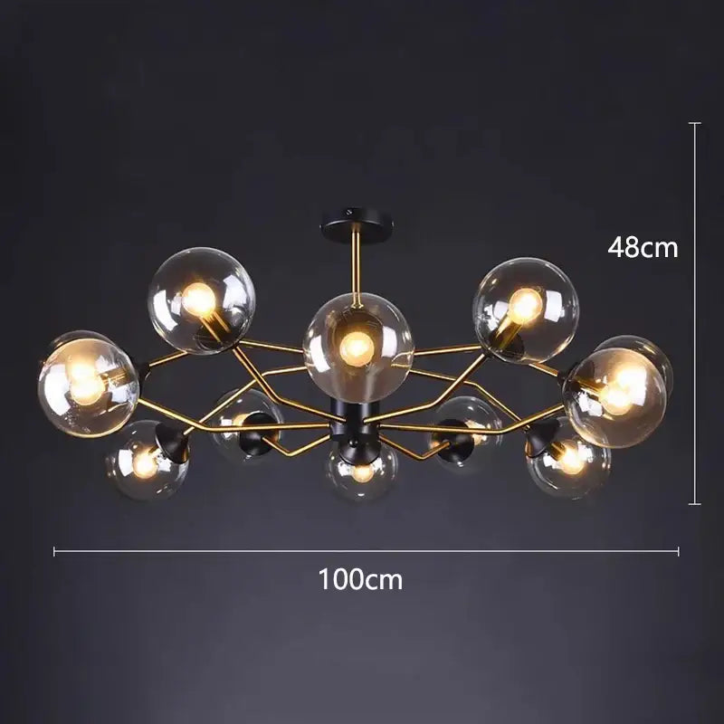 Modern chandelier pendant lights with a gold-toned metal frame and clear glass globe bulbs by DecorBites led pendant