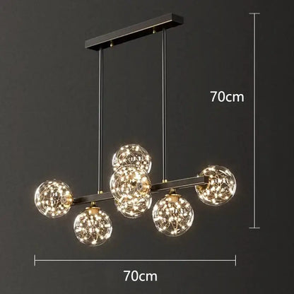 Modern black metal DecorBites led pendant light chandelier with five glowing spherical glass globes and wirework detailing