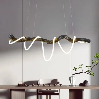 DecorBites LED pendant light featuring dark gnarled wood branch design with glowing white LED strips for modern decor