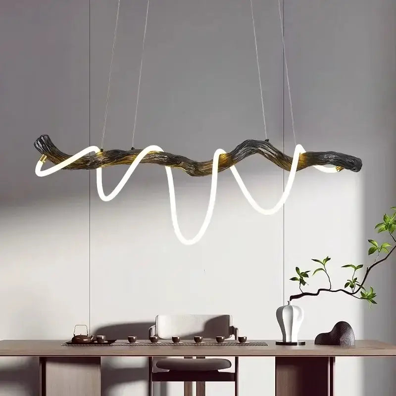 DecorBites LED pendant light featuring dark gnarled wood branch design with glowing white LED strips for modern decor