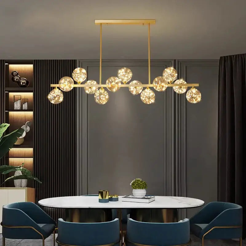 Gold-toned DecorBites led pendant light chandelier with multiple spherical glass globe lights for modern indoor decor