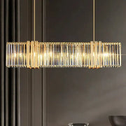 Gold-toned rectangular decorbites led pendant chandelier with vertical crystal rods and warm glowing lights for indoor decor