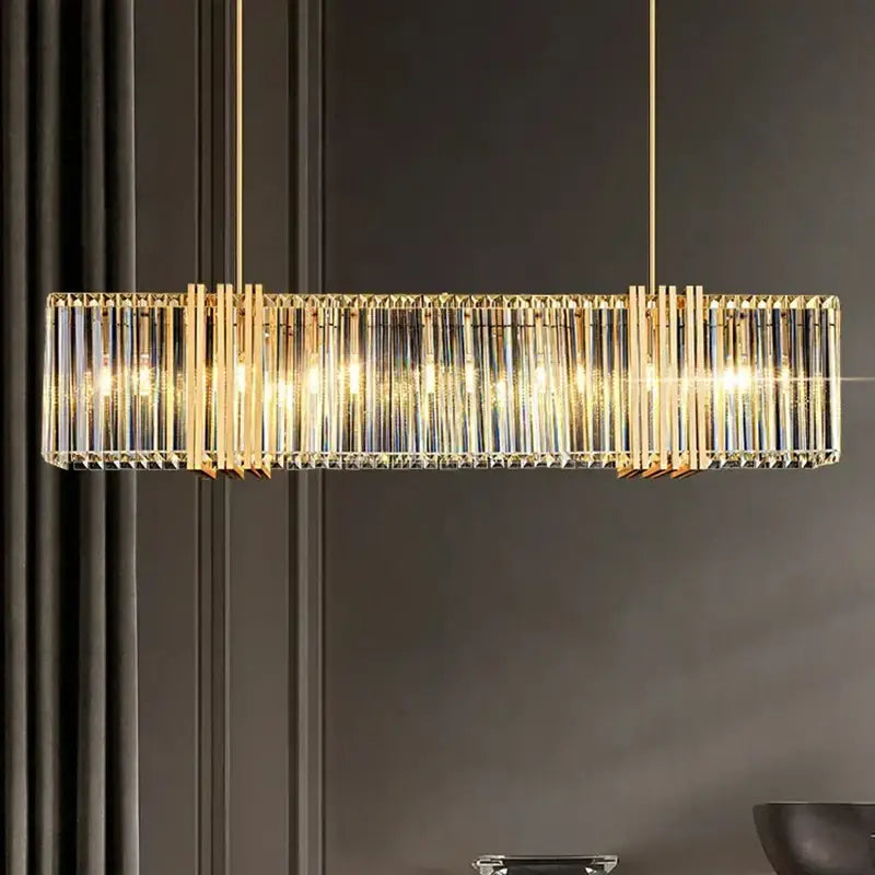 Gold-toned rectangular decorbites led pendant chandelier with vertical crystal rods and warm glowing lights for indoor decor