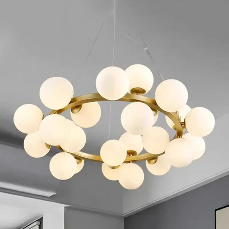 Gold-toned decorbites led pendant light chandelier with frosted glass globe bulbs for modern living and dining rooms