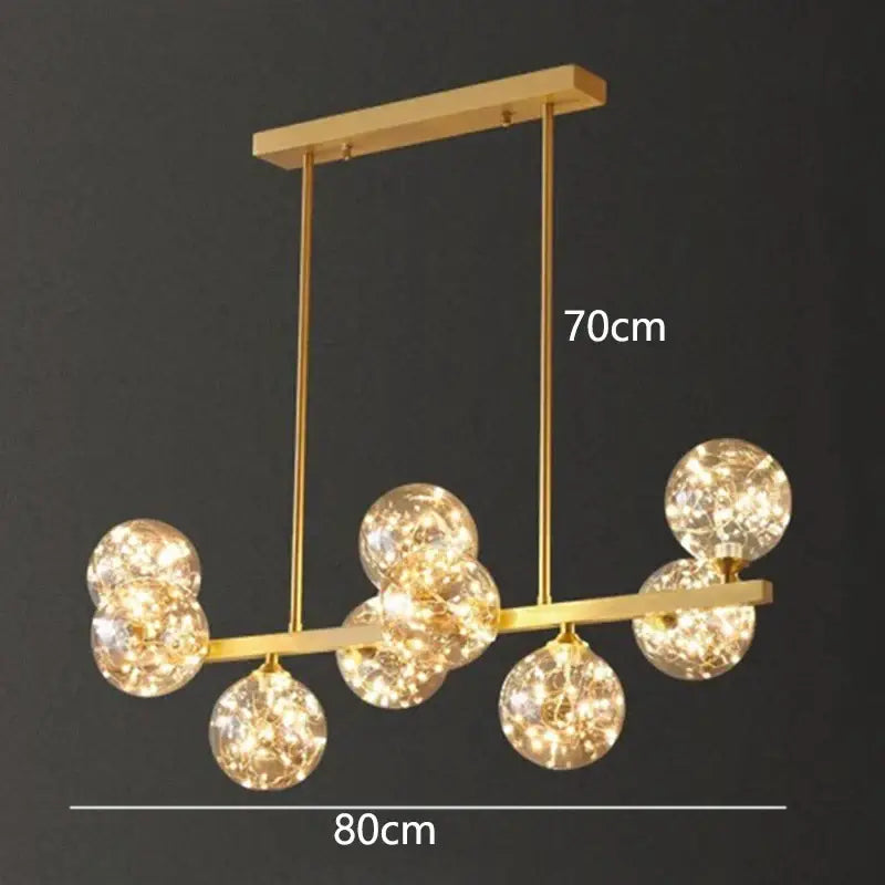 Gold-toned decorbites led pendant light chandelier with spherical glass bulbs on sleek metal frame for modern indoor decor