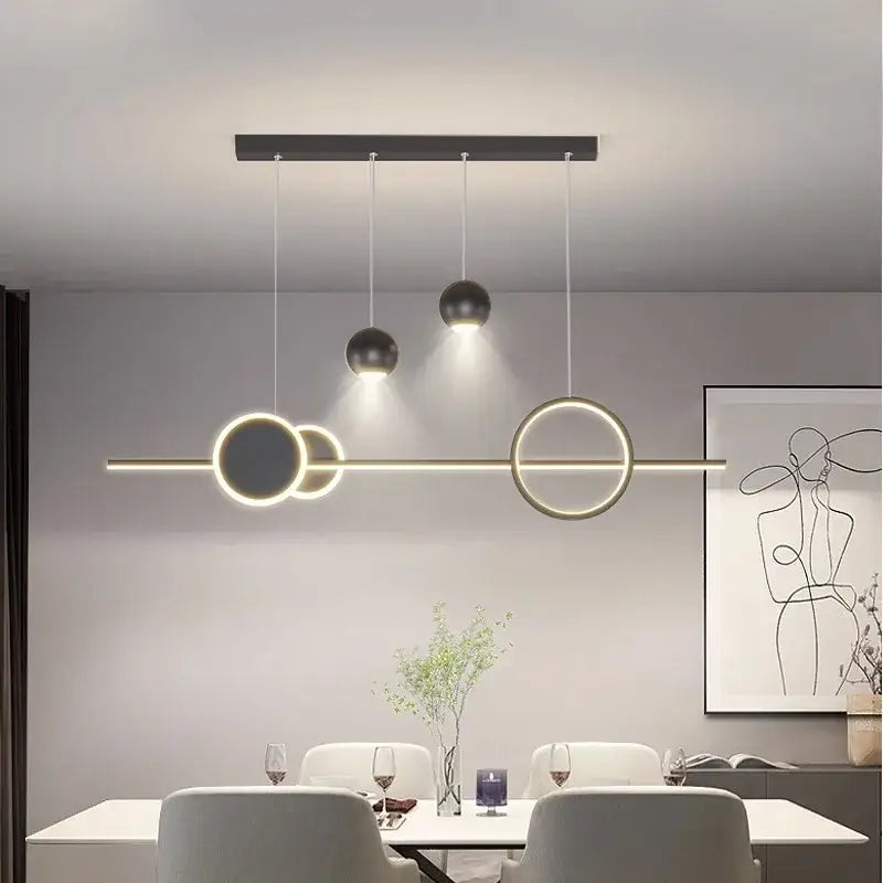 Modern black and gold decorbites led pendant light chandeliers with geometric circular rings and spherical bulbs for indoor lighting