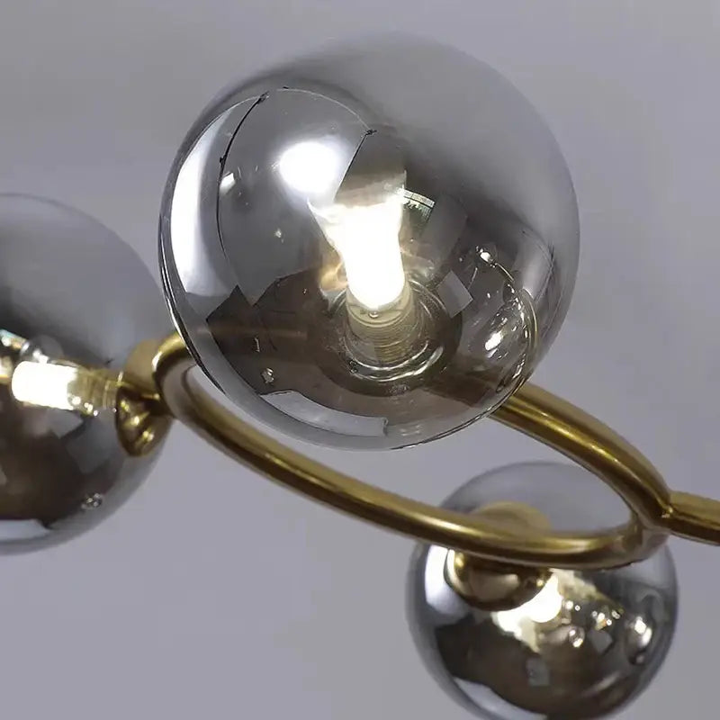 Modern chandelier with polished brass arms and smoked glass spheres in decorbites led pendant light for indoor decor