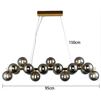 A modern decorbites led pendant featuring smoked glass spheres on a gold metal frame with wooden accents for living rooms