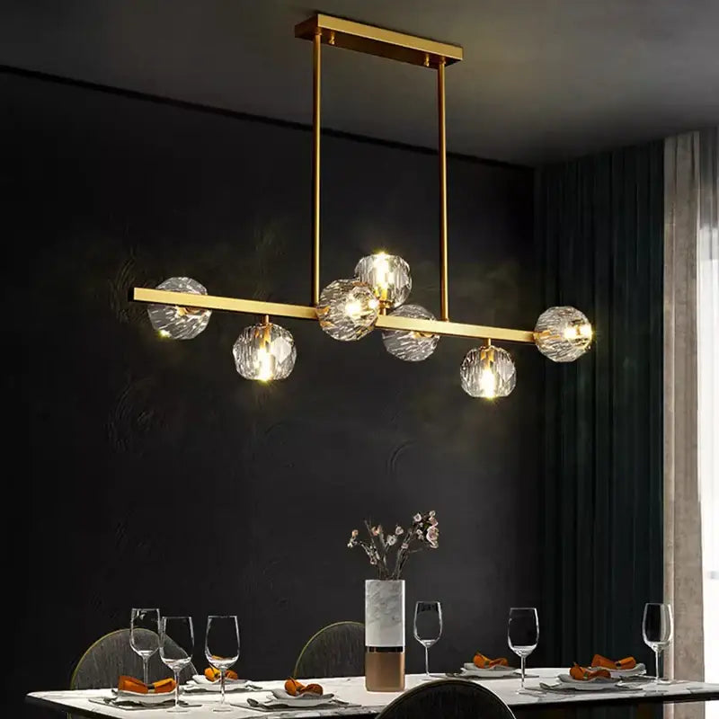 Gold-toned decorbites led pendant light chandelier with six faceted crystal globe shades for modern indoor lighting