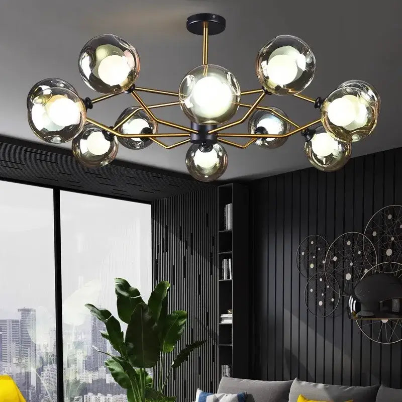 Modern gold-toned decorbites led pendant chandelier with spherical glass bulbs for dining room lighting and home decor