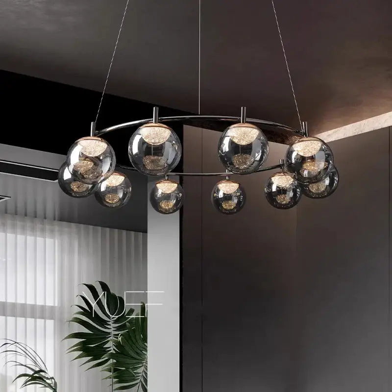 Modern chrome-finished DecorBites LED pendant light chandelier with spherical glass globes and warm-toned LED lights