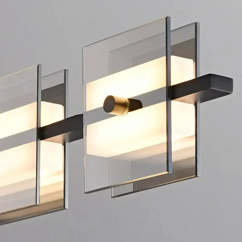 Modern wall sconce with clear glass panels and brass accents featured in decorbites led pendant light for indoor lighting