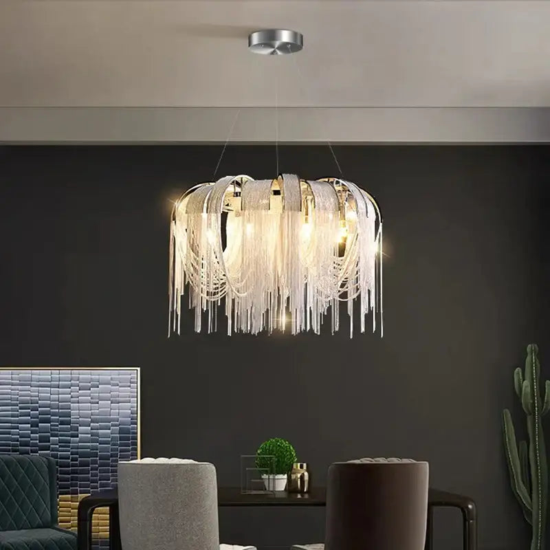 A modern DecorBites led pendant light chandelier with cascading white translucent fringes and a sleek metallic frame