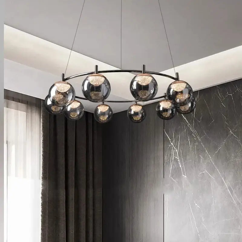 Modern black-framed DecorBites LED pendant light chandelier with reflective glass globe shades for indoor lighting