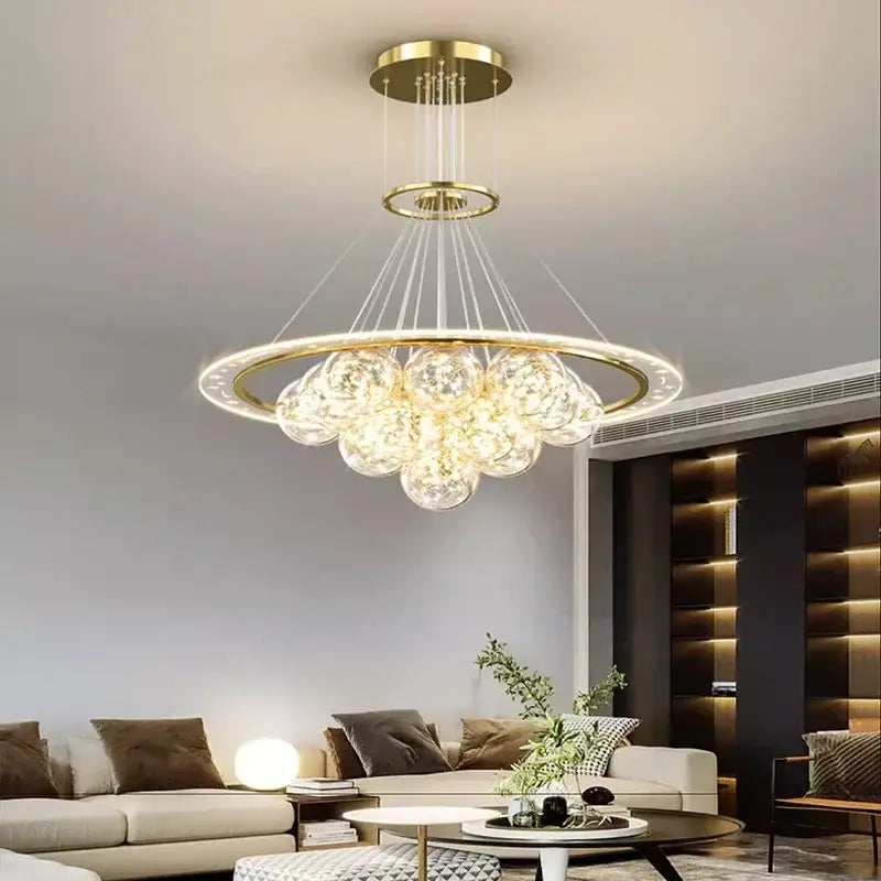 Gold-toned DecorBites LED pendant light chandelier with circular frame and clear glass globe bulbs for modern decor