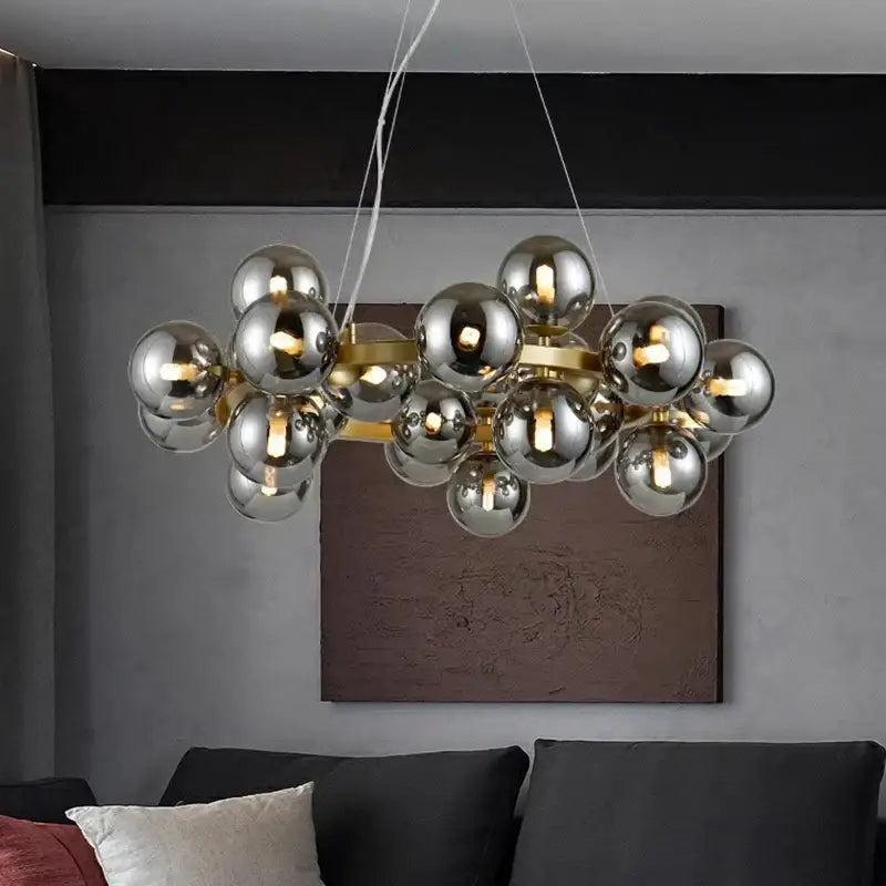 Modern decorbites led pendant light chandeliers with reflective chrome spheres and gold-toned frame for living room lighting