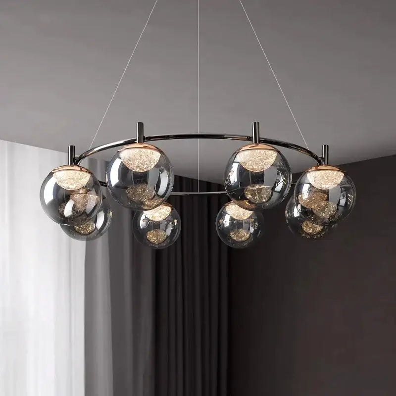 Modern chrome-finished decorbites led pendant light chandelier with spherical glass globes and warm glowing leds