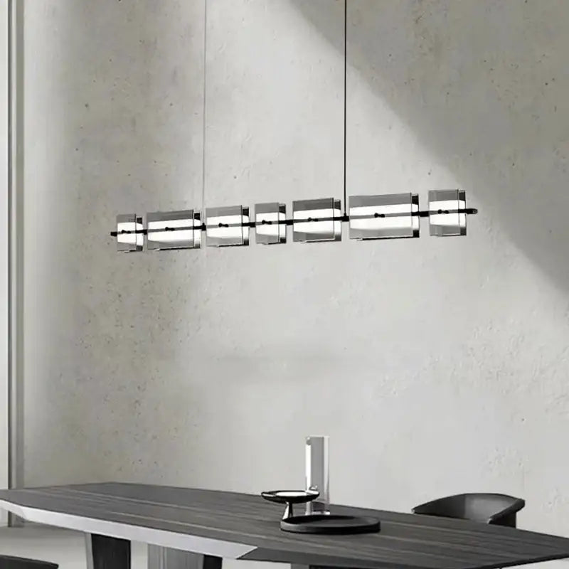 Modern minimalist decorbites led pendant light with six translucent acrylic panels on a black metal frame for indoor use