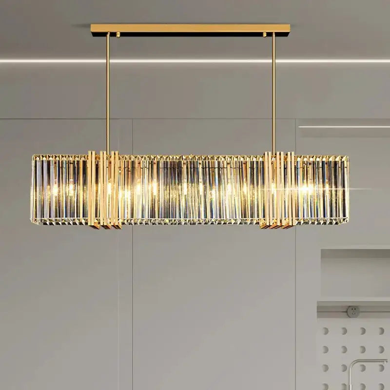 Gold-toned decorbites led pendant light chandelier with vertical crystal rods and warm glowing lights for modern decor